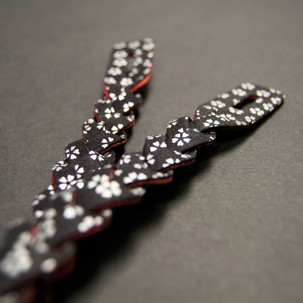 Pair of Orimono Chichikawa with silver sakura pattern